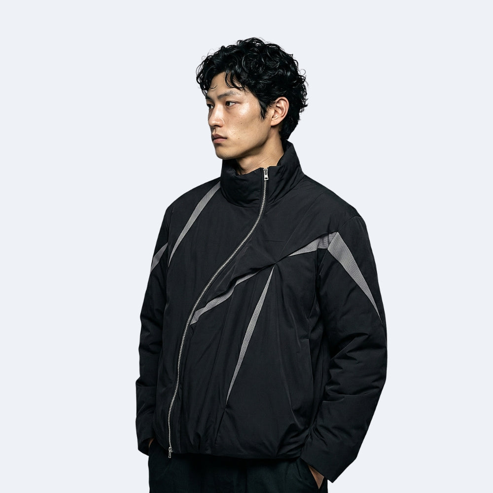Black. A man wearing a black lightweight jacket with gray geometric stripe details.