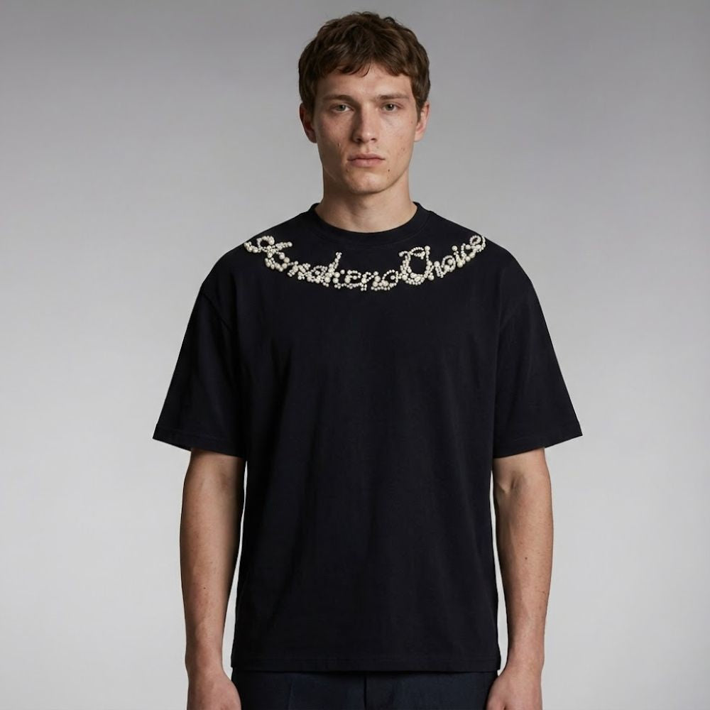 Person wearing a black t-shirt with white text on a gray background
